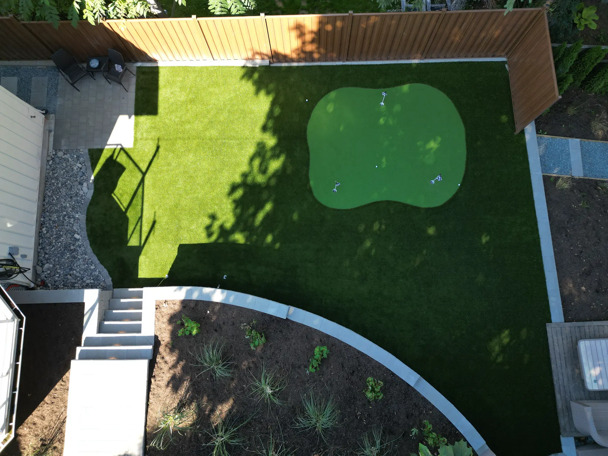 Top-down aerial view of the custom multi-hole putting green