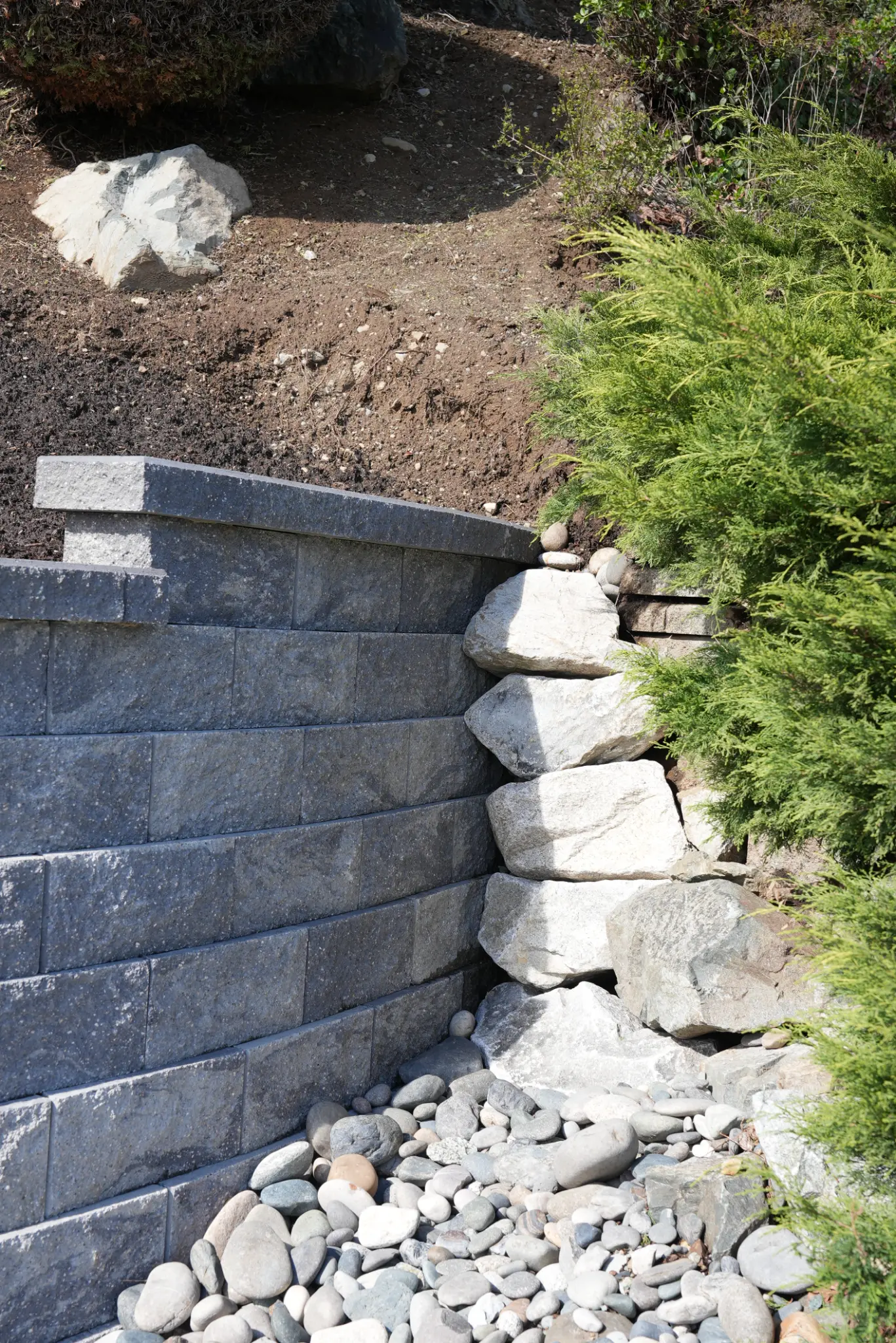Block wall with armour stone detail