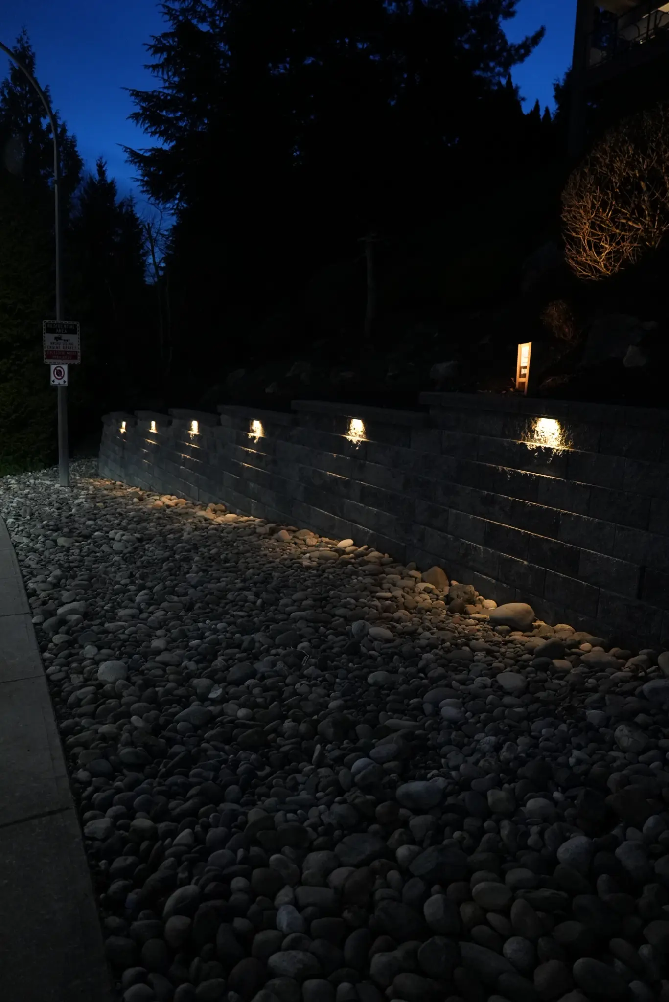 Retaining wall detail with lighting at dusk