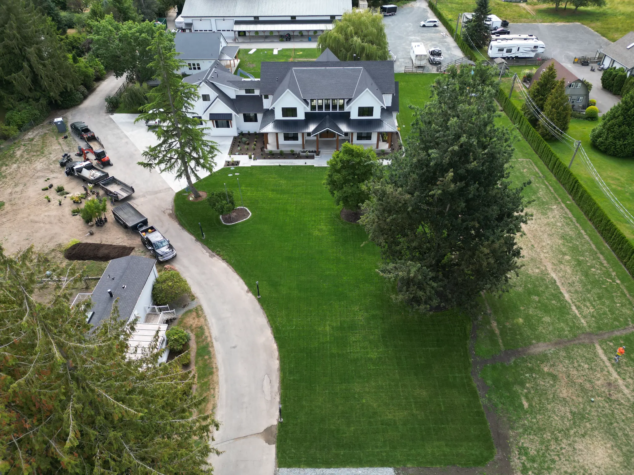 Aerial view of Fraser Valley estate with fresh sod lawn and landscaping