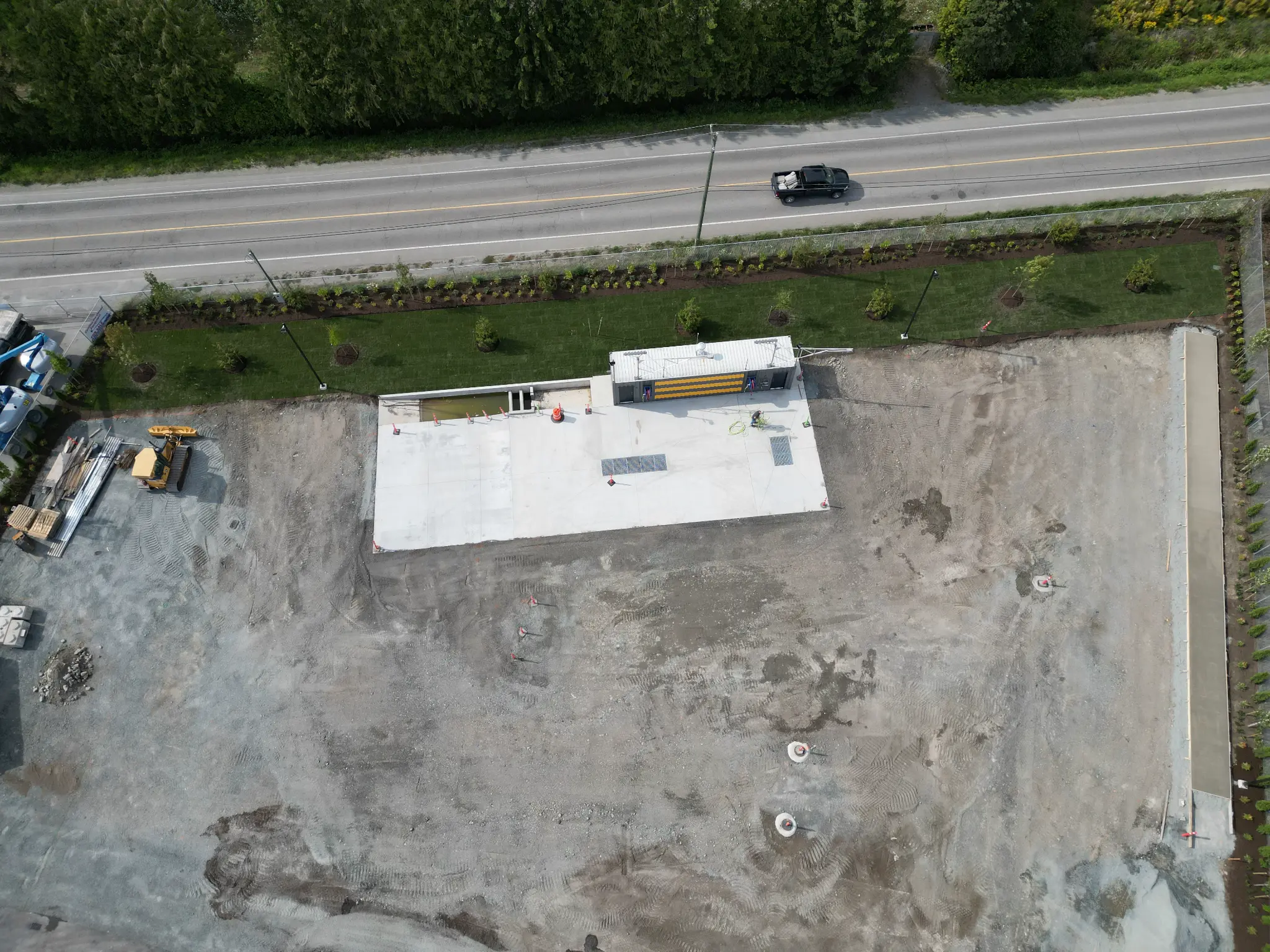 Aerial progress view of the commercial site and roadside landscaping