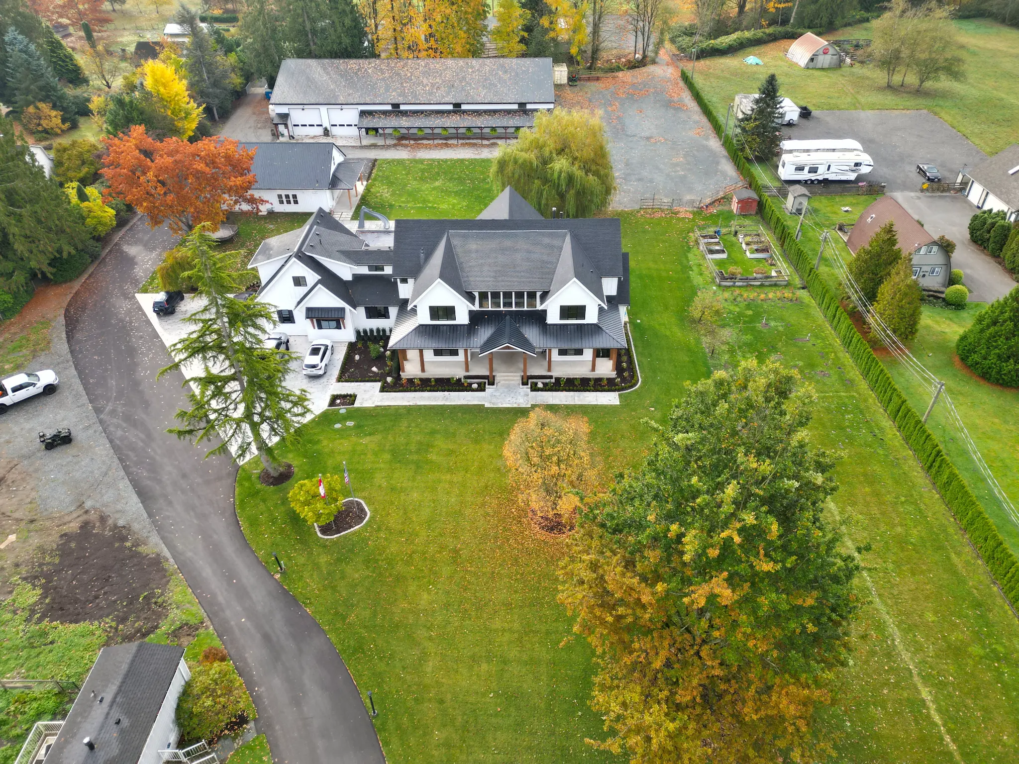 Wide drone view of the full Langley estate property