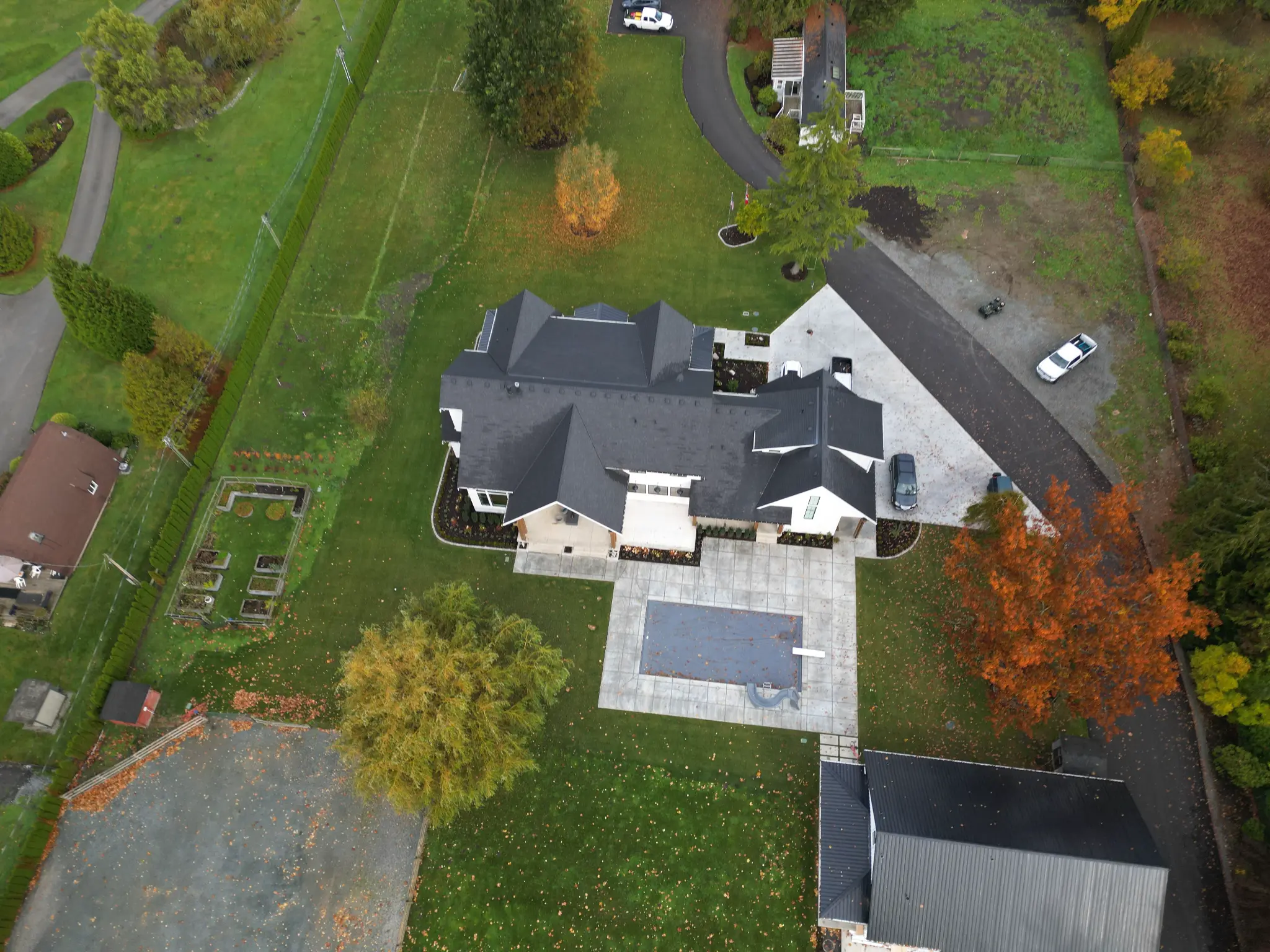 Closer aerial view of the mansion's finished outdoor areas