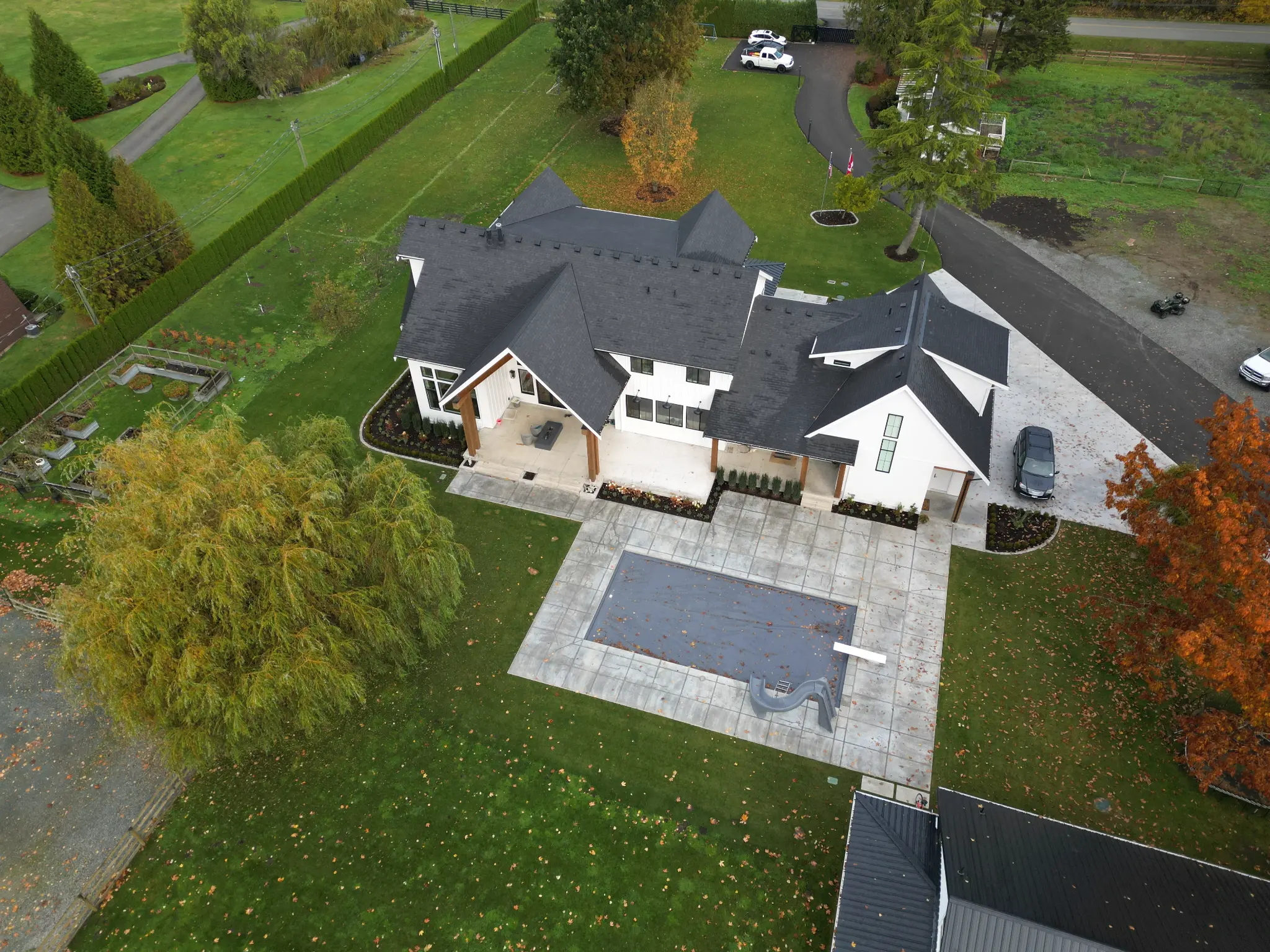 Drone view of the residence and carefully finished landscape