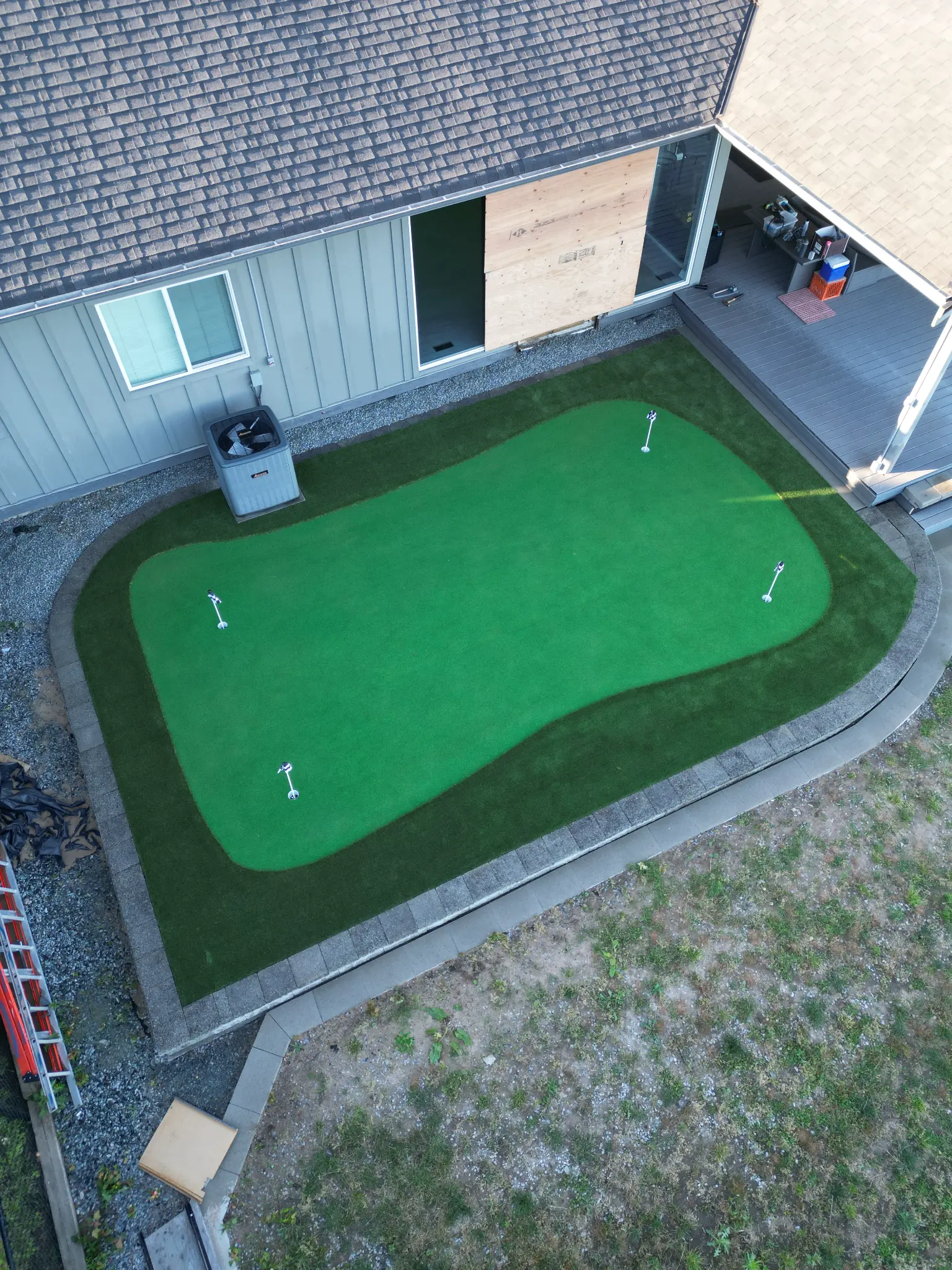 Wide drone view of the Maple Ridge property and completed landscape
