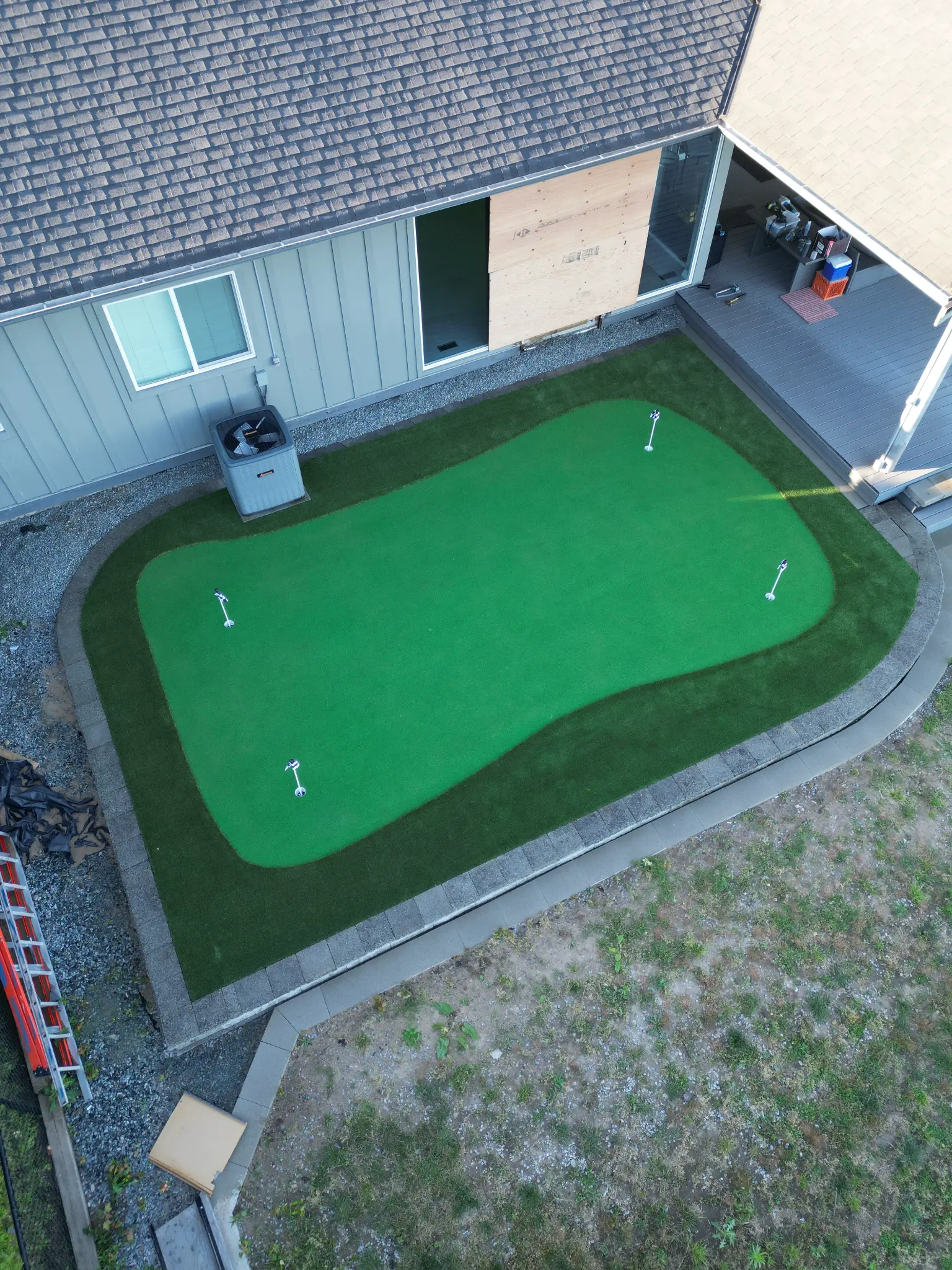 Aerial view of the backyard grade changes managed by retaining walls