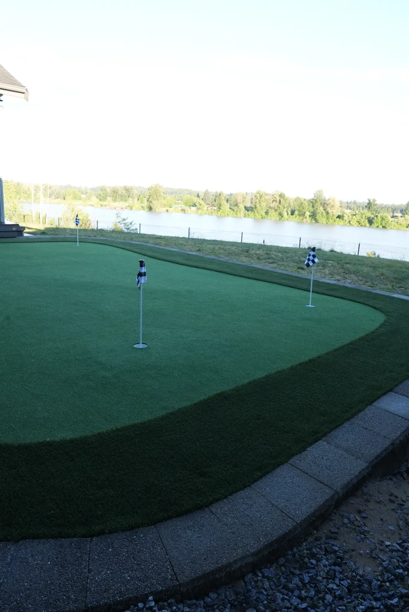 Illuminated retaining wall bordering the completed putting green