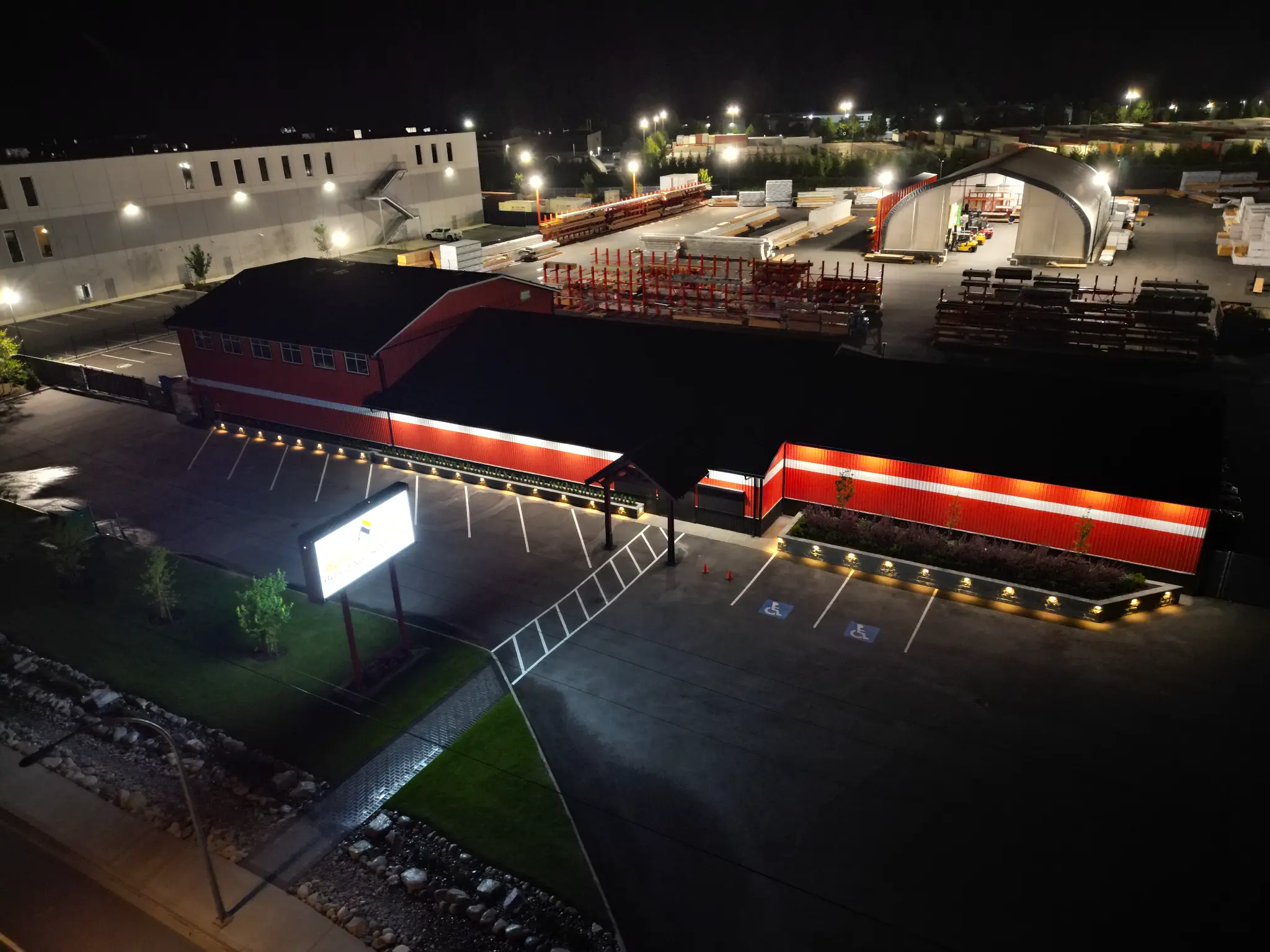 Aerial night view of the North Coast commercial site with illuminated raised planters