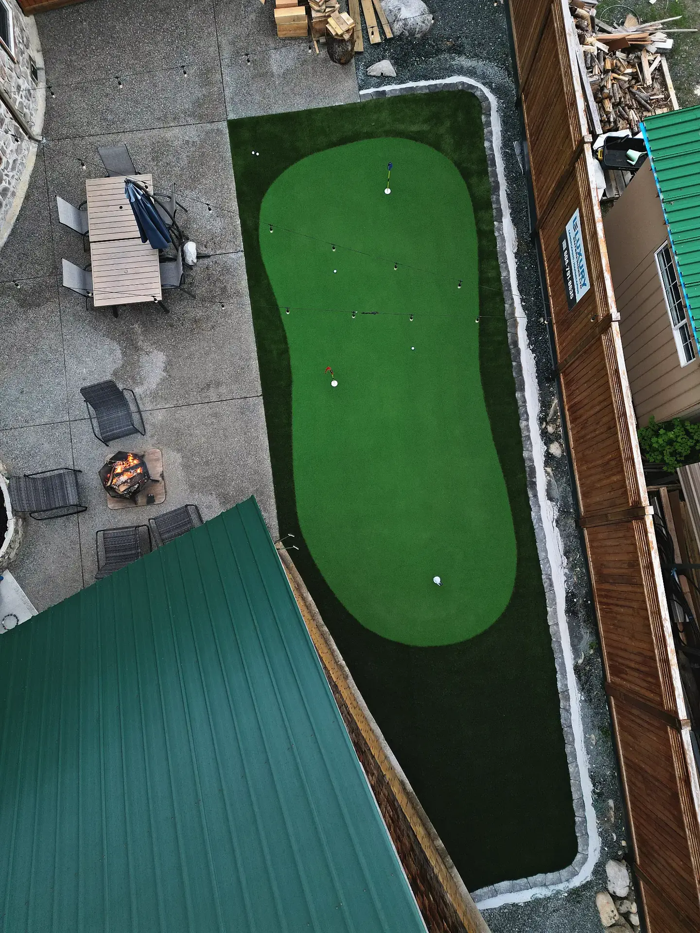 Aerial evening view of the Chilliwack Treehouse Airbnb putting green