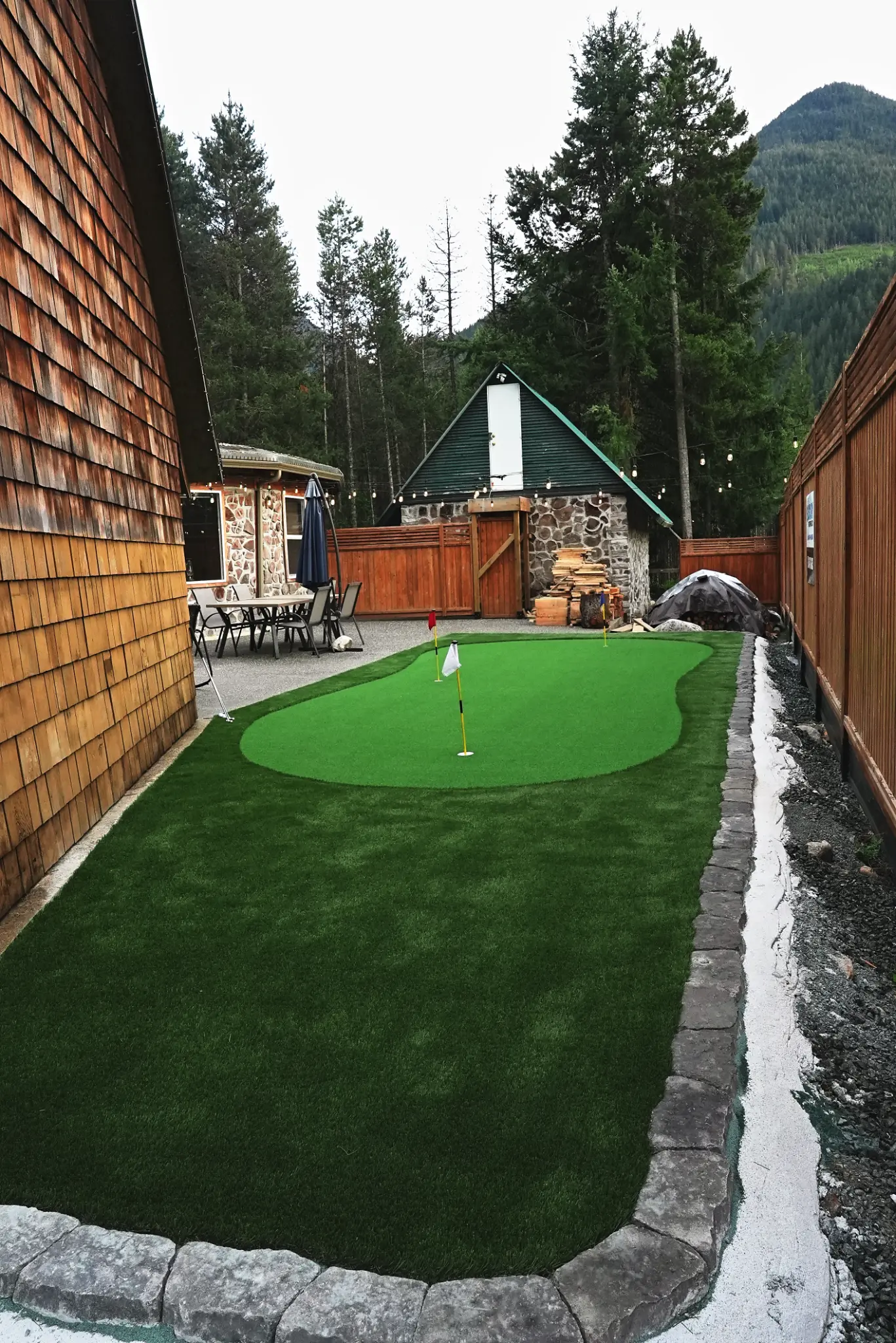 Putting green with rock borders and lighting